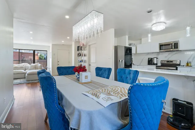 a view of kitchen with cabinets and wooden floor