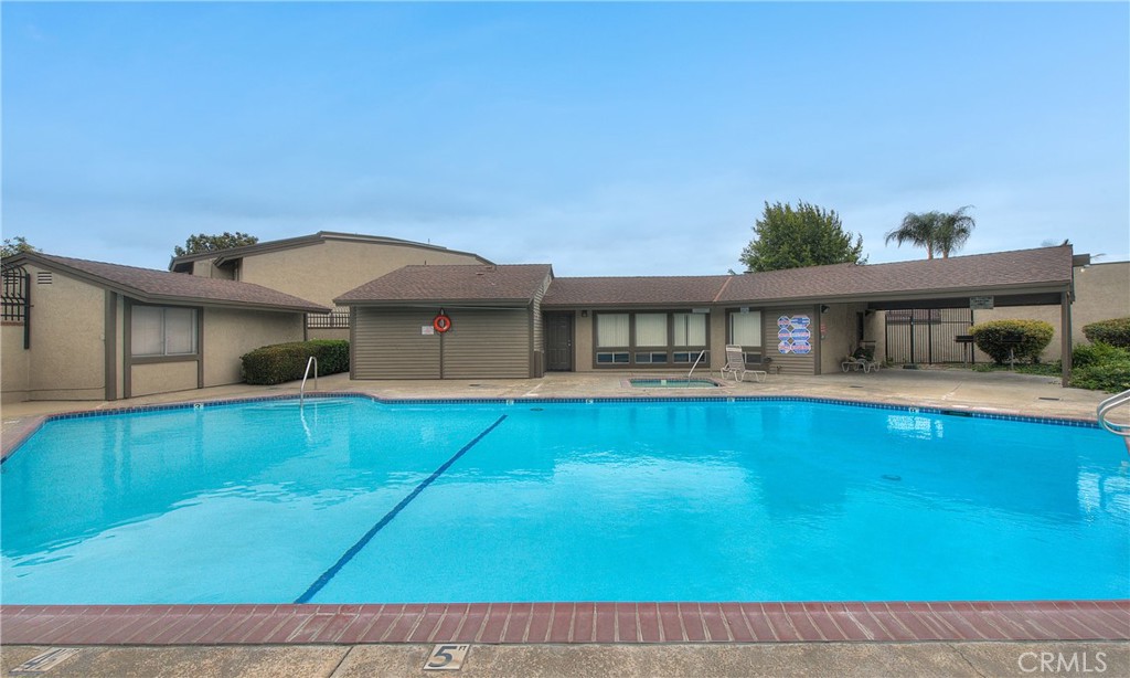 6351 Riverside Drive, Unit 69 Chino, CA 91710 - Photo 17 of 21 a front view of a house with a yard