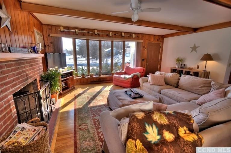 1047 Lakeview Road Copake, NY 12516 - Photo 4 of 10 a living room with furniture and a large window