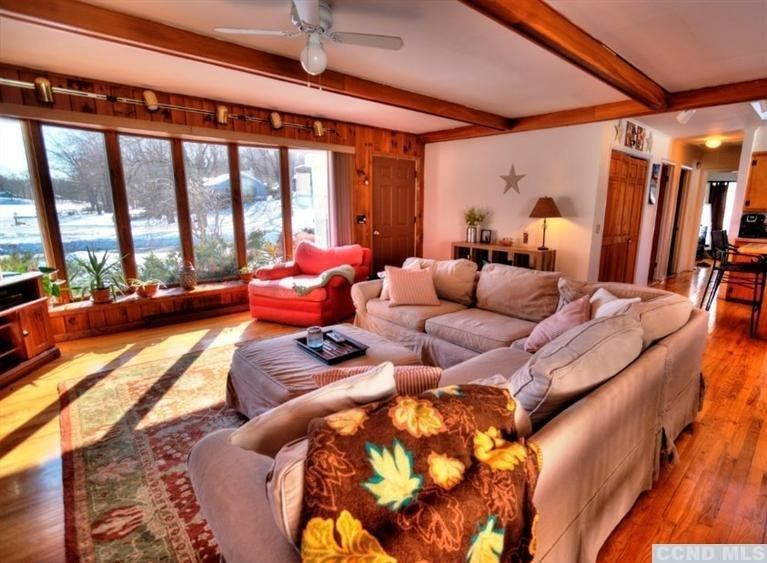 1047 Lakeview Road Copake, NY 12516 - Photo 5 of 10 a living room with furniture and a large window