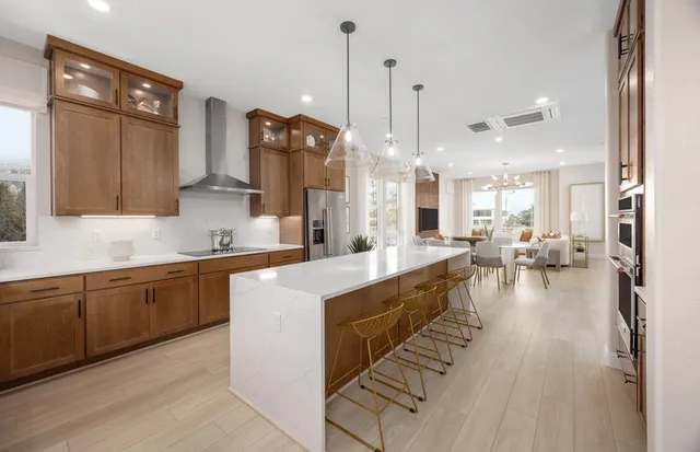 a kitchen with counter top space a sink appliances and cabinets