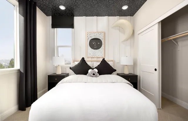 a bed room with a bed and a window