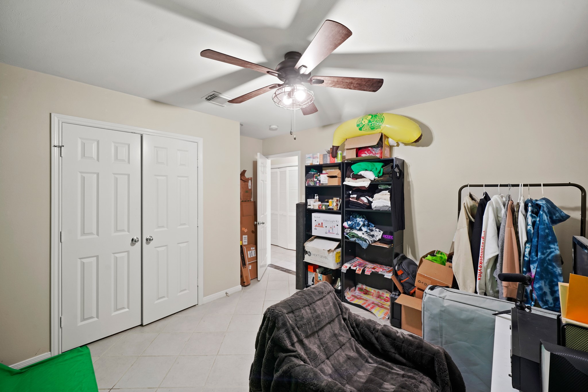 2605 West Dallas Street Houston, TX 77019 - Photo 16 of 29 a bedroom with furniture a chandelier and a window