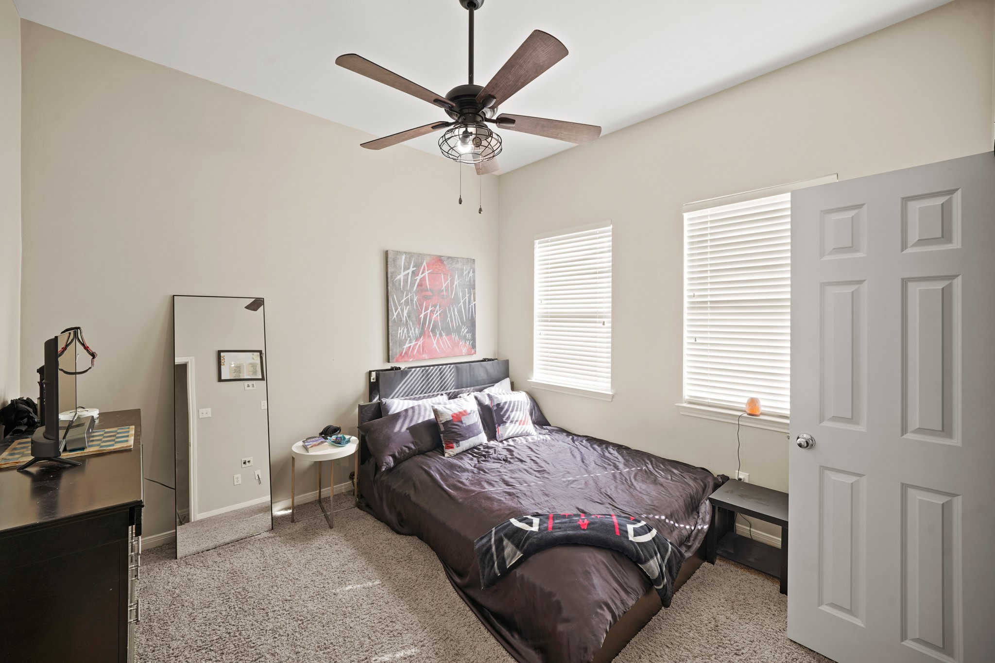2605 West Dallas Street Houston, TX 77019 - Photo 21 of 29 a bedroom with a bed and a chandelier