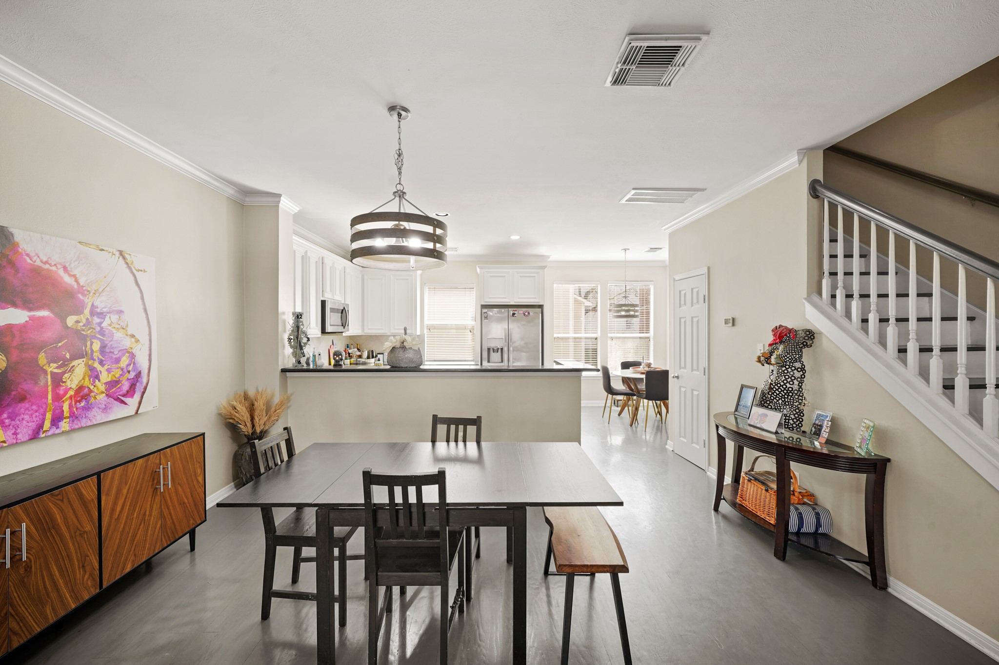 2605 West Dallas Street Houston, TX 77019 - Photo 9 of 29 a view of a dining room with furniture and a chandelier