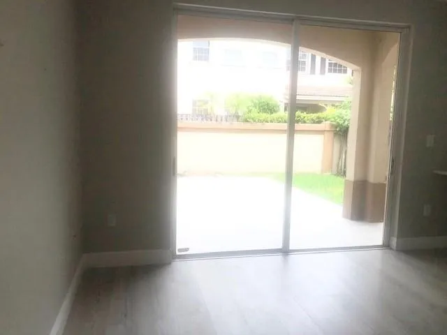 a view of an empty room and a window