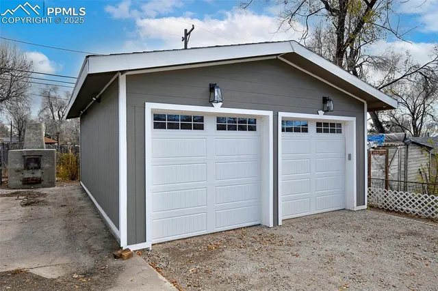 a front view of a house with garage
