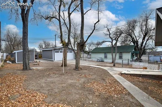 a house with trees in the background