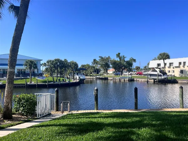a view of a lake with a house in the background