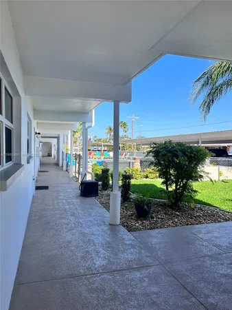 a view of a house with backyard and garden