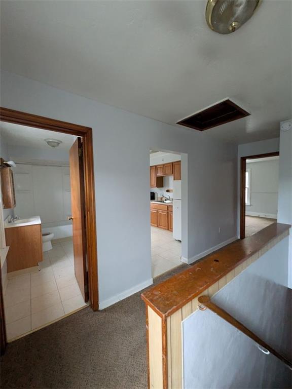 725 Chartiers Street, Unit 2 Bridgeville, PA 15017 - Photo 11 of 19 a room that has a bed and a night stand in it