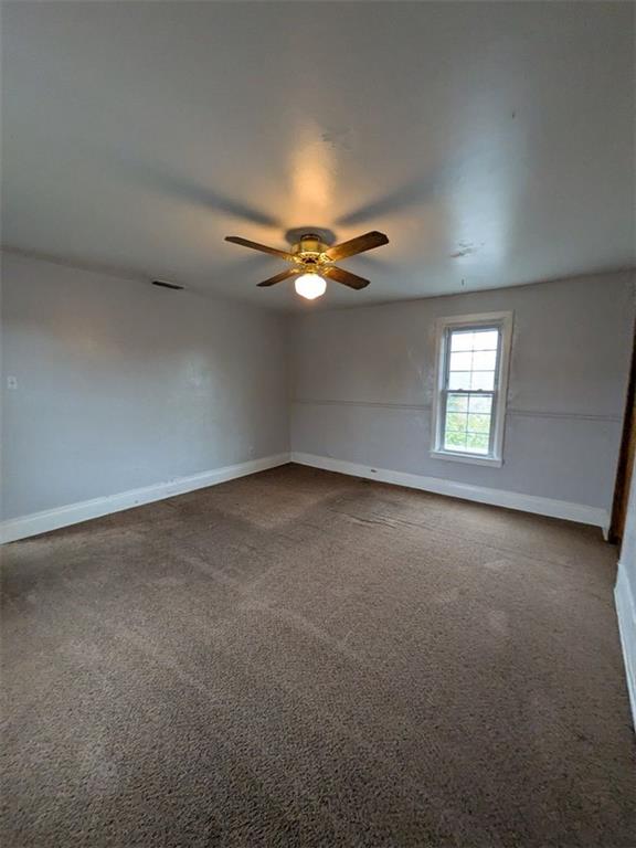 725 Chartiers Street, Unit 2 Bridgeville, PA 15017 - Photo 6 of 19 an empty room with a window and a ceiling fan