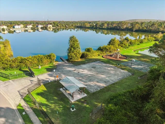 an aerial view of a house with a ocean view
