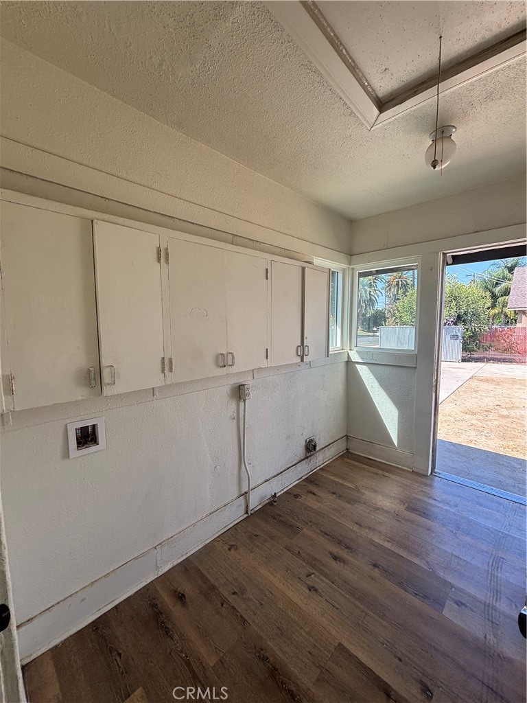 4793 Grove Riverside Ca Riverside, CA 92507 - Photo 13 of 23 a view of a kitchen with wooden floor and white doors