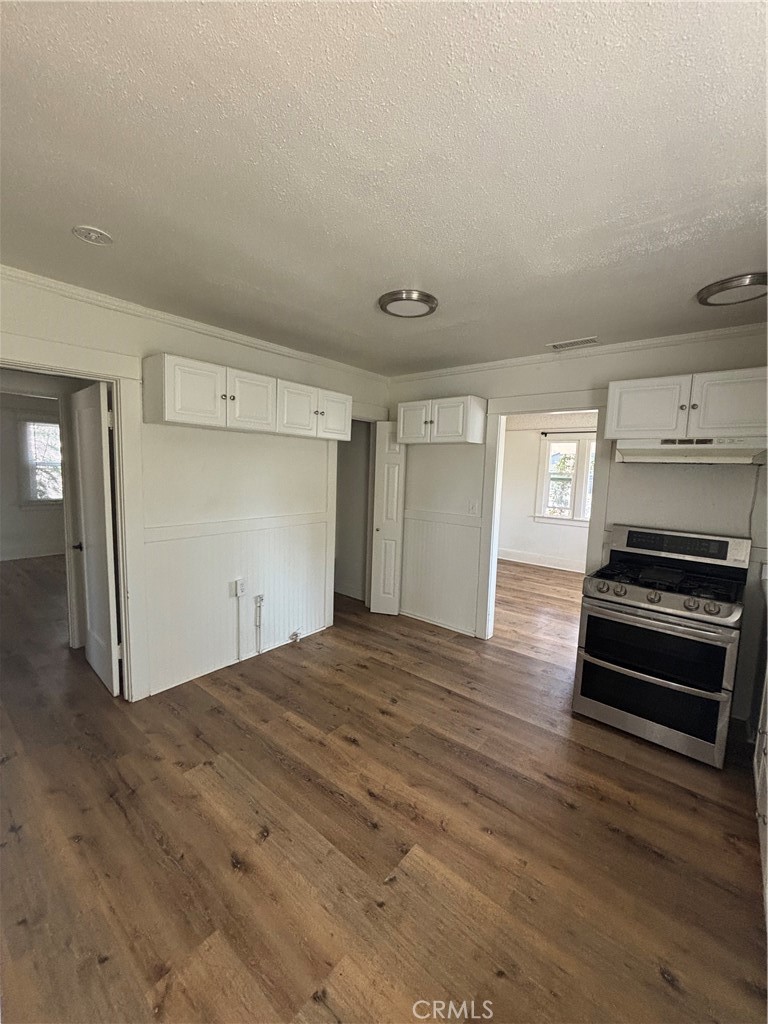 4793 Grove Riverside Ca Riverside, CA 92507 - Photo 17 of 23 a view of empty room with wooden floor