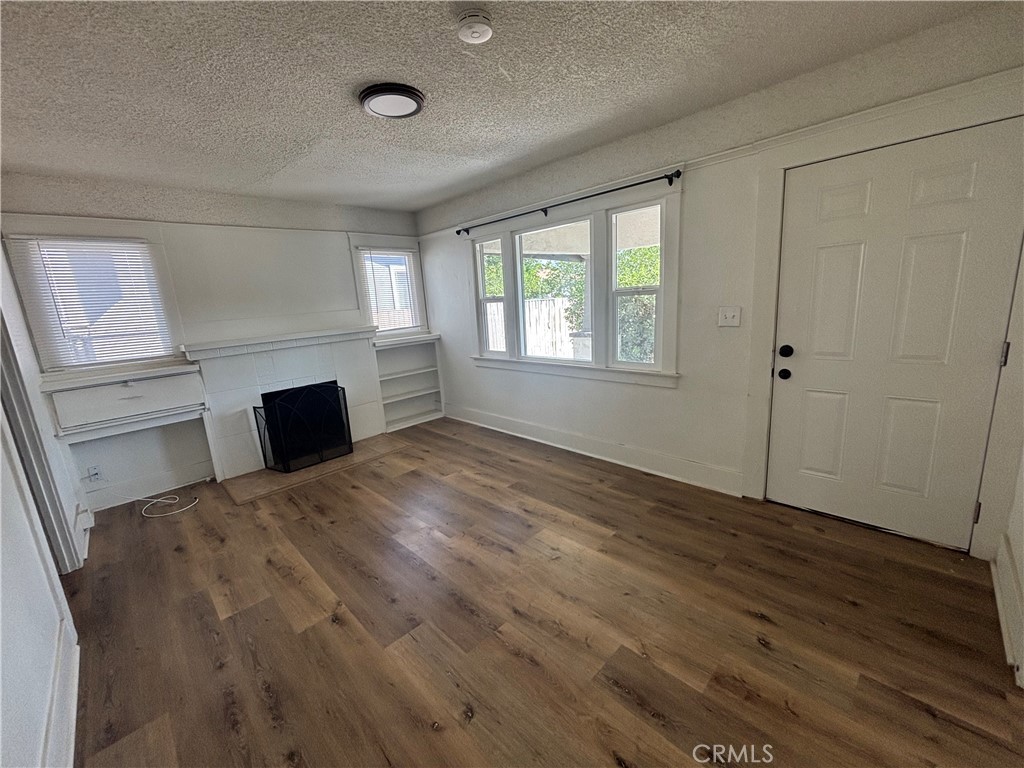 4793 Grove Riverside Ca Riverside, CA 92507 - Photo 21 of 23 a view of empty room with wooden floor and fan