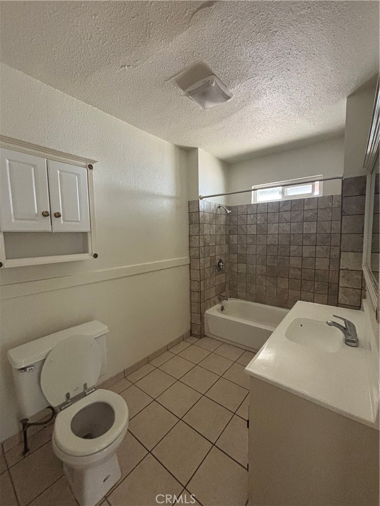 4793 Grove Riverside Ca Riverside, CA 92507 - Photo 9 of 23 a bathroom with a sink a toilet and shower
