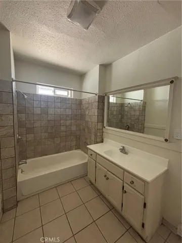 a bathroom with a sink and a shower