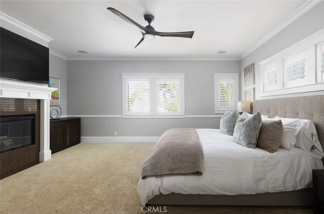 a bedroom with a bed and a television