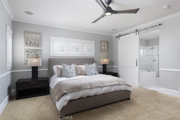 a bathroom with a granite countertop sink a large mirror and a bathtub