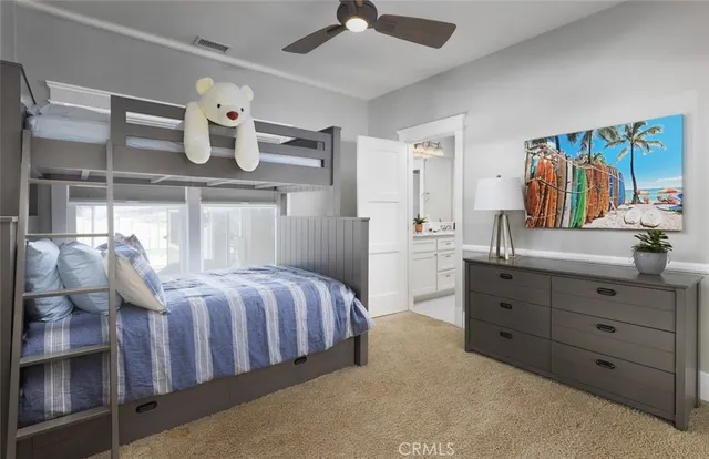 a bathroom with a granite countertop sink a mirror and a shower