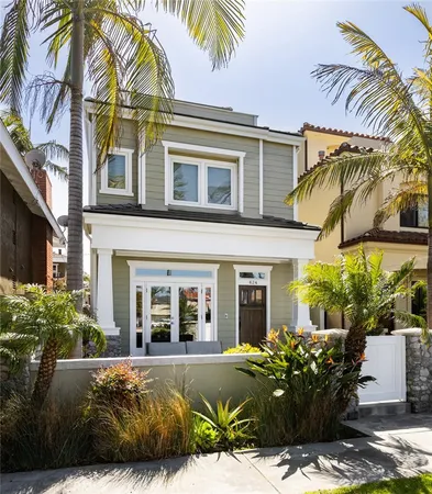 a view of a patio with couches table and chairs and potted plants