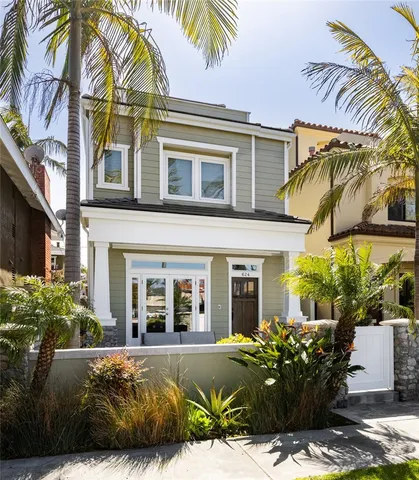 a view of a patio with couches table and chairs and potted plants