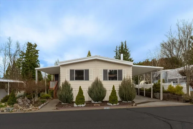 a view of a car park in front of house