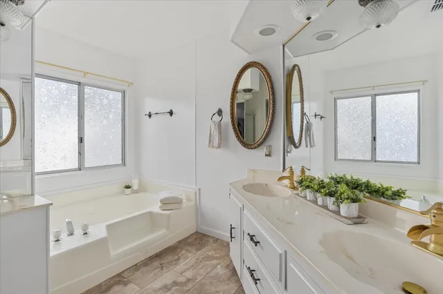 a bathroom with a bathtub and a shower