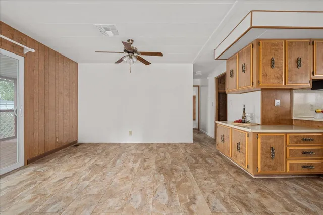 a view of a kitchen with furniture and a window