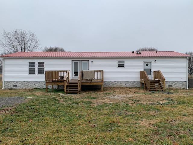 2132 Sagely Anderson Road Manchester, TN 37355 - Photo 2 of 14 a view of a house with a barbeque and wooden fence