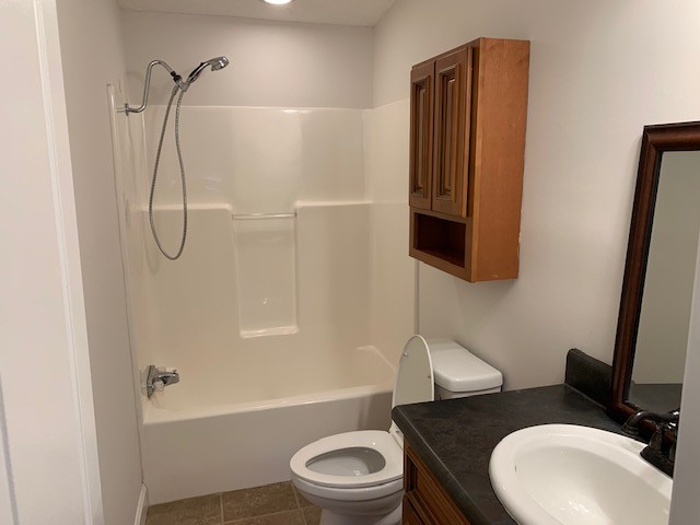 2132 Sagely Anderson Road Manchester, TN 37355 - Photo 14 of 14 a bathroom with a granite countertop toilet sink and shower