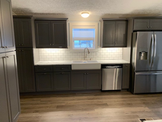 2132 Sagely Anderson Road Manchester, TN 37355 - Photo 5 of 14 a kitchen with granite countertop a refrigerator and a sink