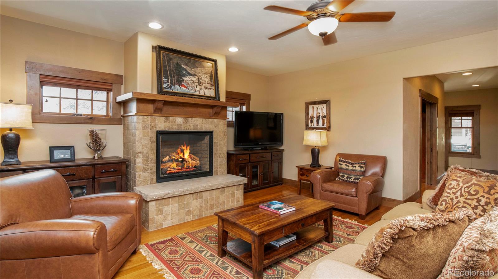 21 Meadow Trail Fraser, CO 80442 - Photo 11 of 36 a living room with furniture and a fireplace