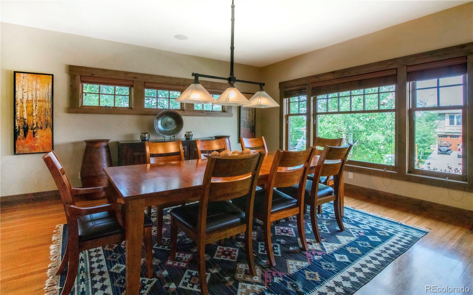 21 Meadow Trail Fraser, CO 80442 - Photo 15 of 36 a dining room with furniture a chandelier and wooden floor