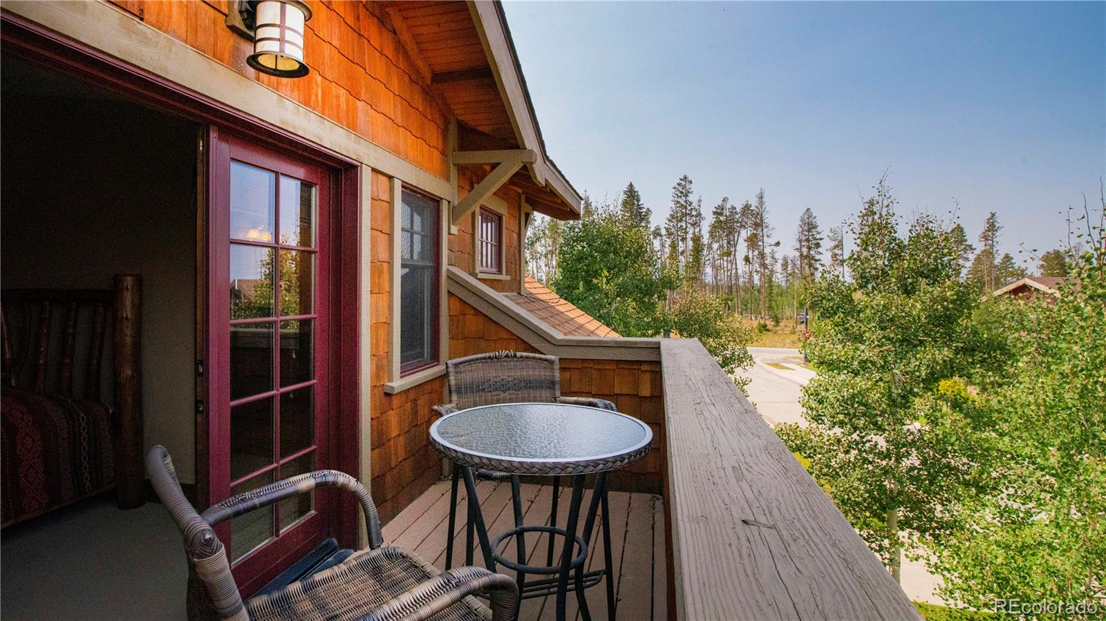21 Meadow Trail Fraser, CO 80442 - Photo 2 of 36 a backyard of a house with table and chairs