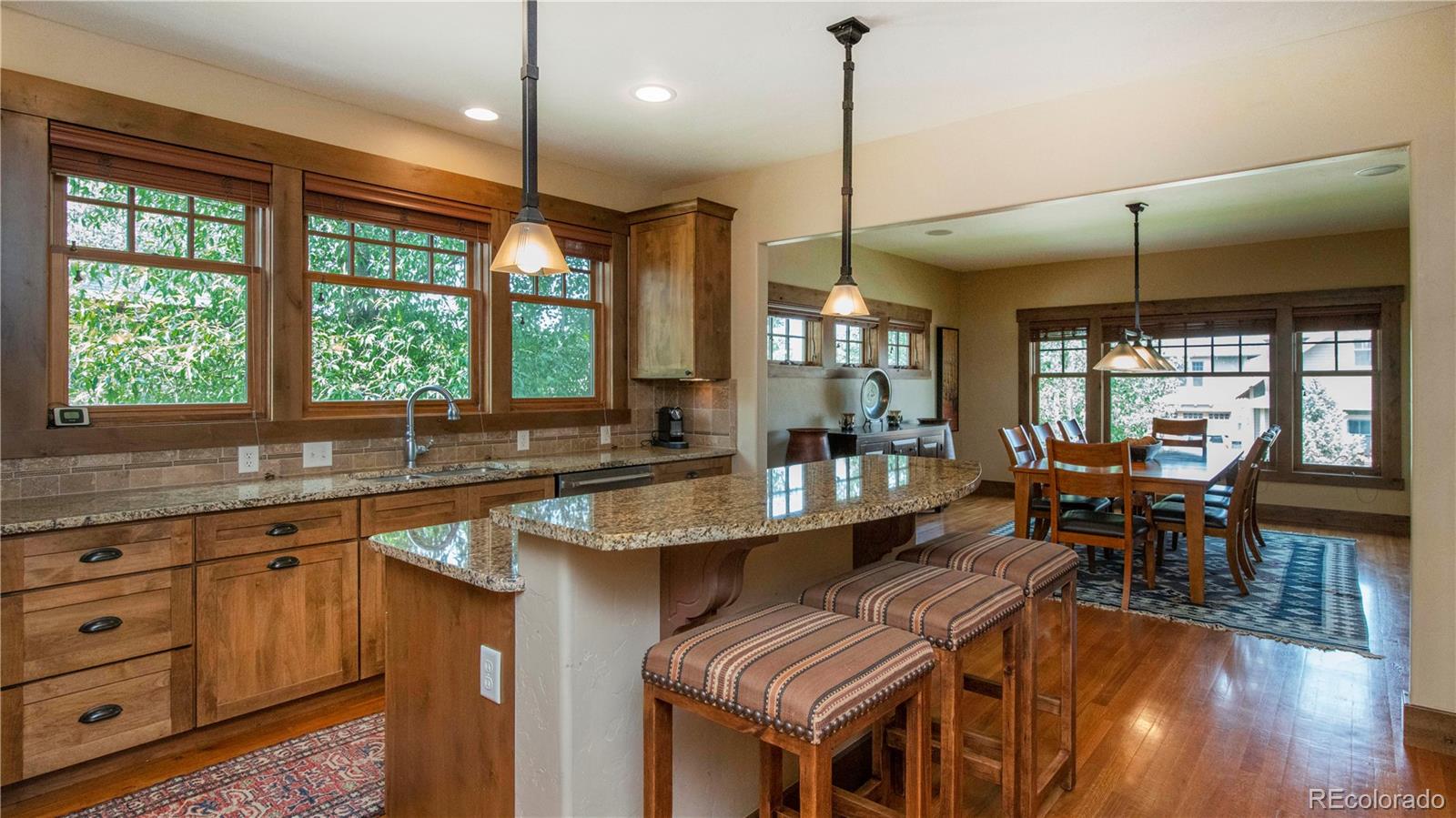 21 Meadow Trail Fraser, CO 80442 - Photo 21 of 36 a kitchen with sink dining table and chairs