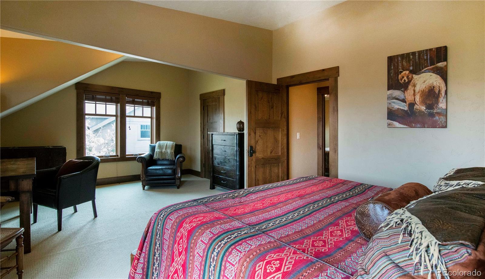 21 Meadow Trail Fraser, CO 80442 - Photo 27 of 36 a bedroom with a bed couch and a window