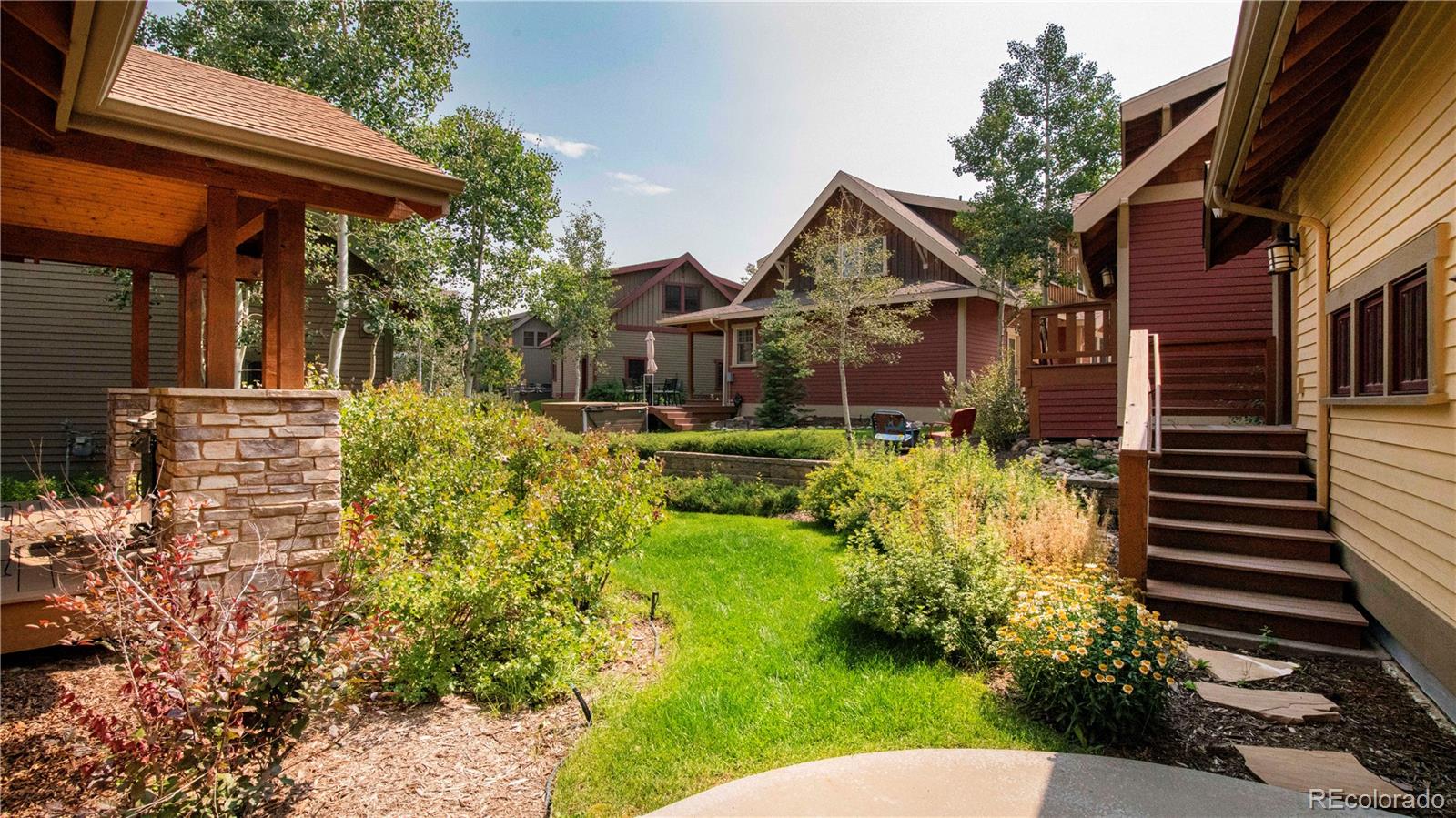 21 Meadow Trail Fraser, CO 80442 - Photo 3 of 36 a view of a house with a small yard plants and large tree