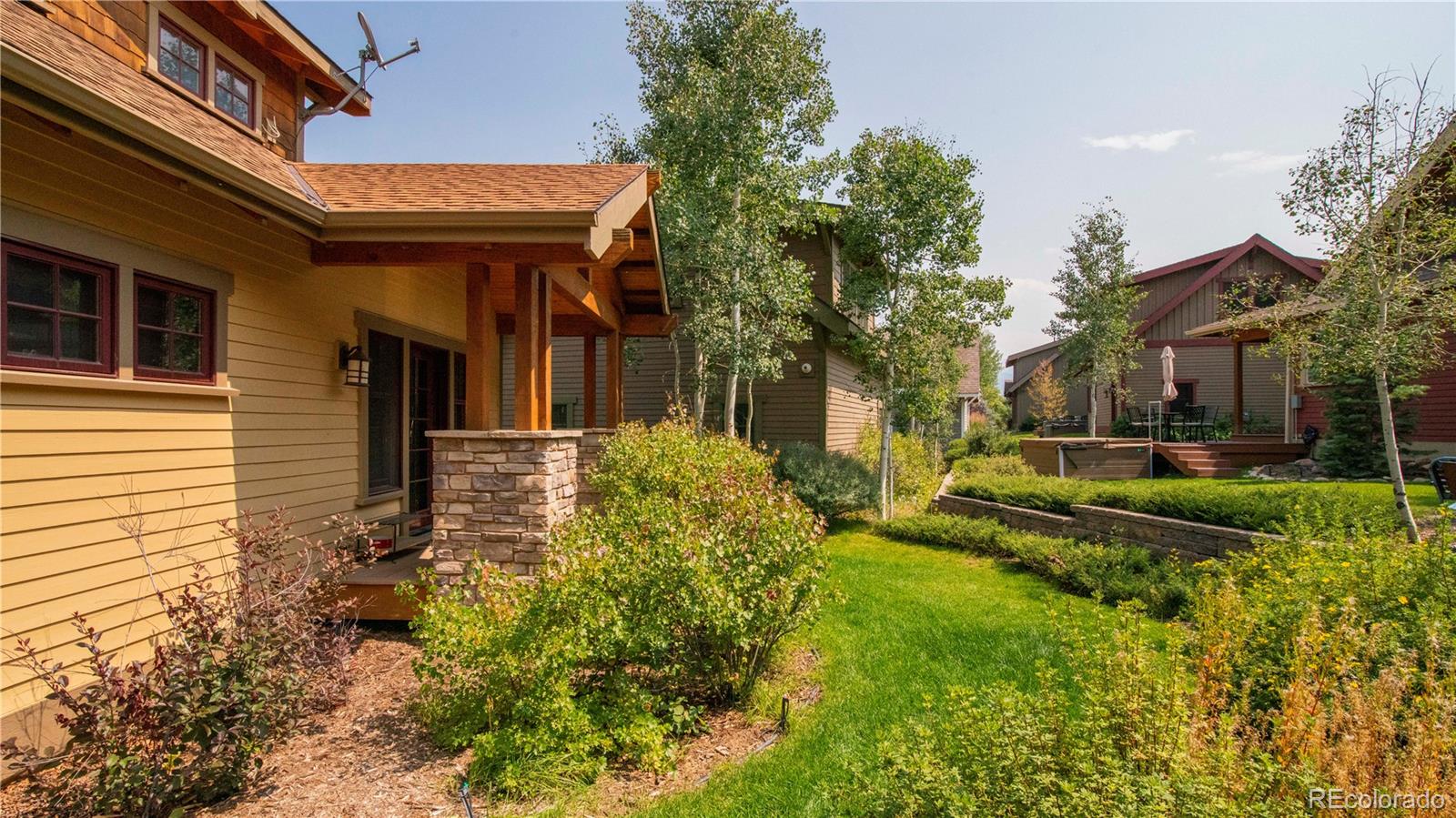 21 Meadow Trail Fraser, CO 80442 - Photo 4 of 36 a view of a house with a small yard plants and large tree