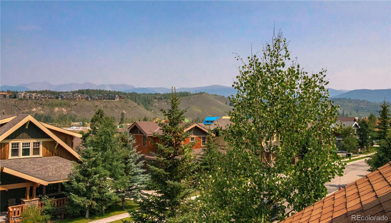 21 Meadow Trail Fraser, CO 80442 - Photo 7 of 36 a aerial view of a house with a yard and lake view