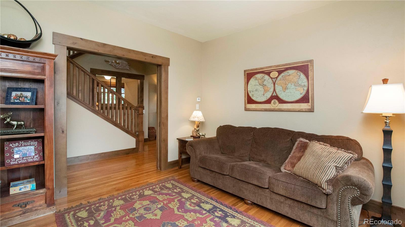 21 Meadow Trail Fraser, CO 80442 - Photo 9 of 36 a living room with furniture and a wooden floor