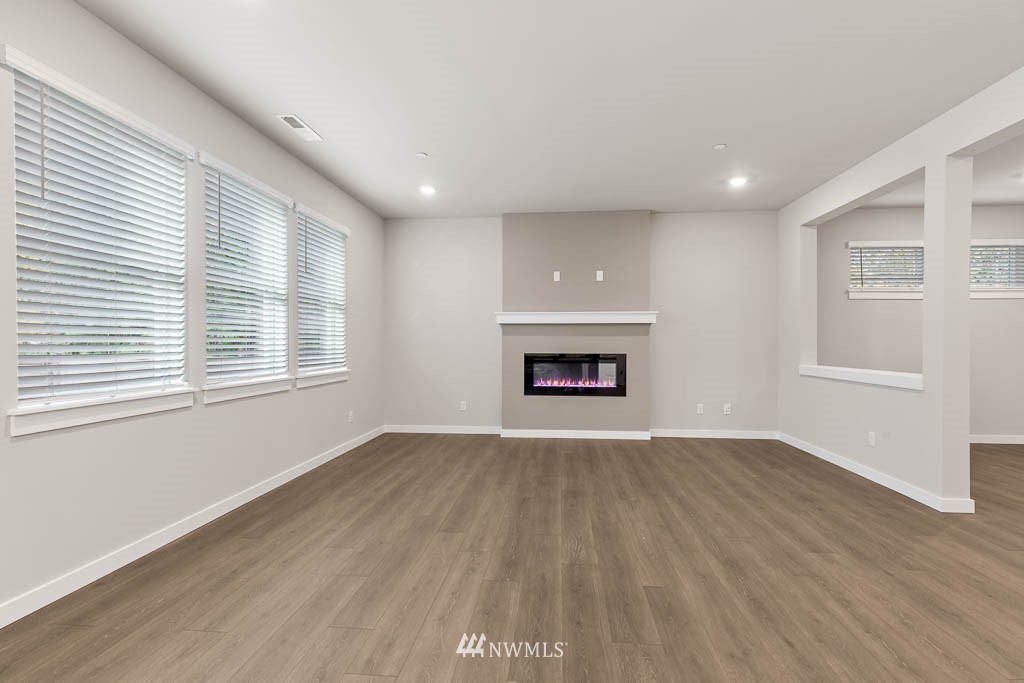6 180th Place Southeast, Unit 34 Bothell, WA 98012 - Photo 13 of 36 an empty room with windows and fireplace