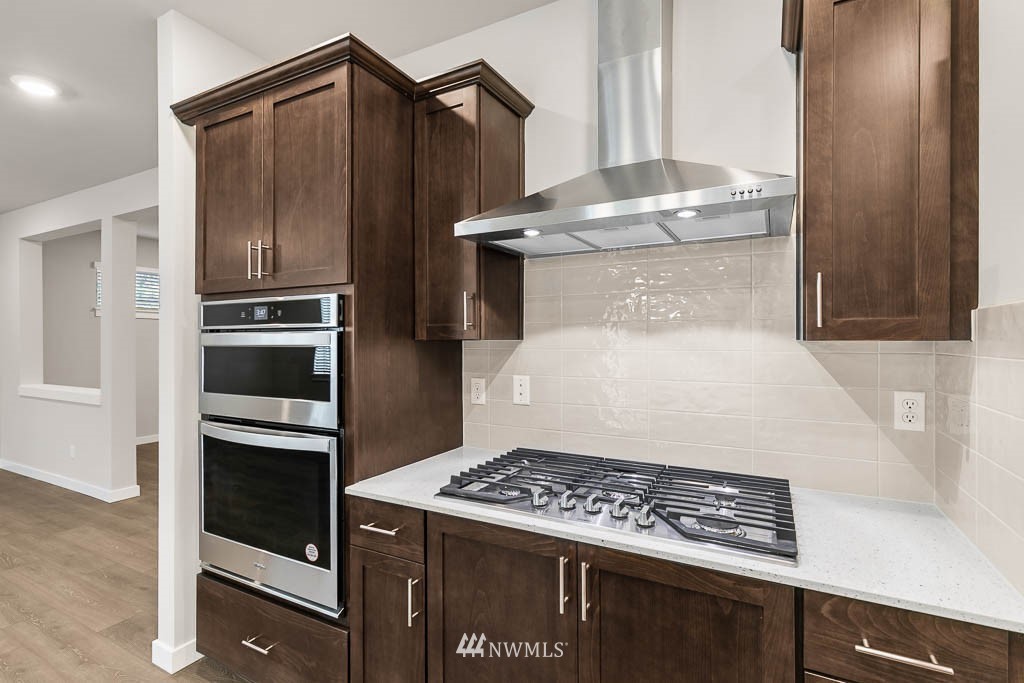 6 180th Place Southeast, Unit 34 Bothell, WA 98012 - Photo 16 of 36 a kitchen with a refrigerator and a stove