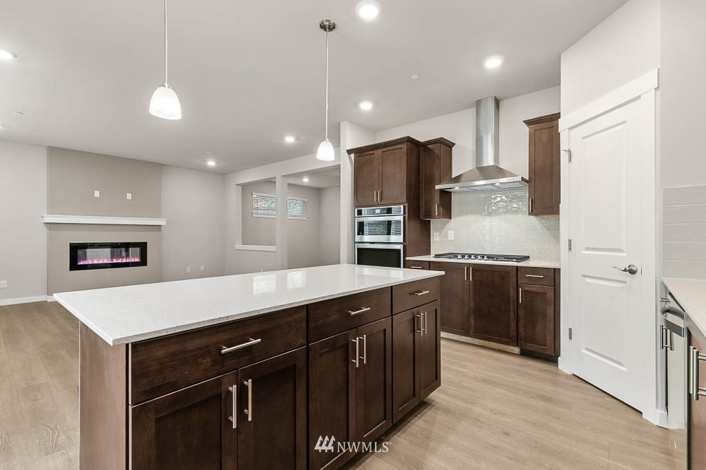 6 180th Place Southeast, Unit 34 Bothell, WA 98012 - Photo 19 of 36 a kitchen with kitchen island a sink stainless steel appliances and cabinets