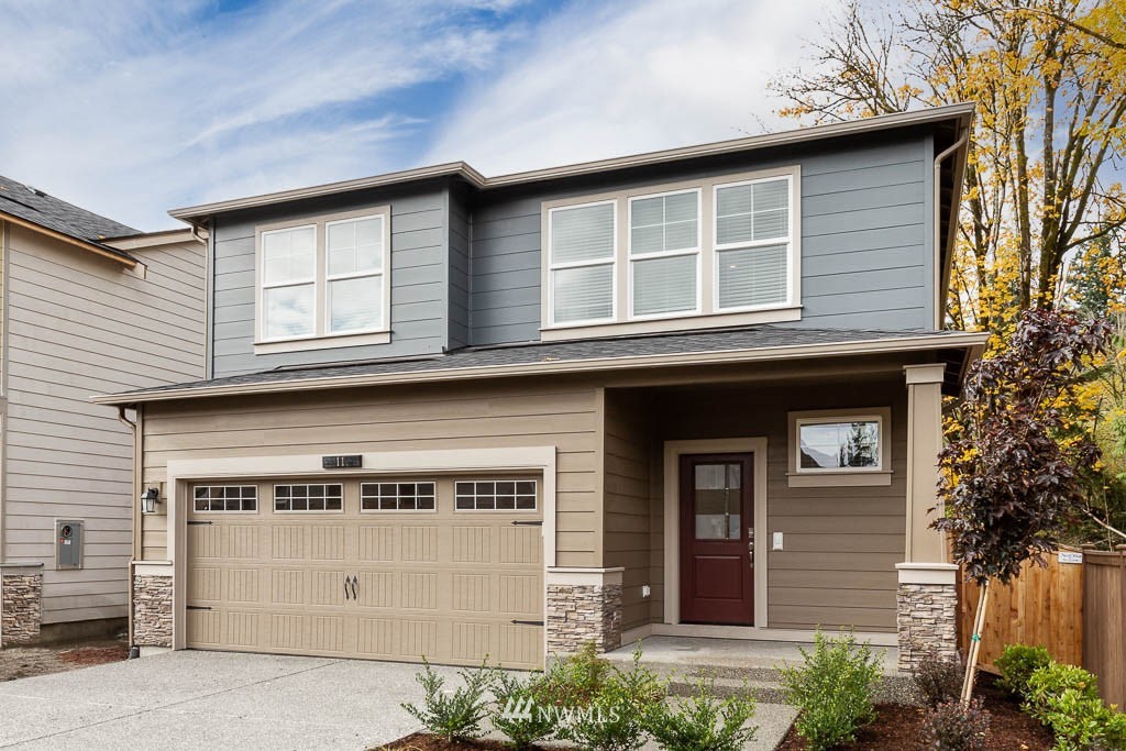 6 180th Place Southeast, Unit 34 Bothell, WA 98012 - Photo 2 of 36 a front view of a house with a garage