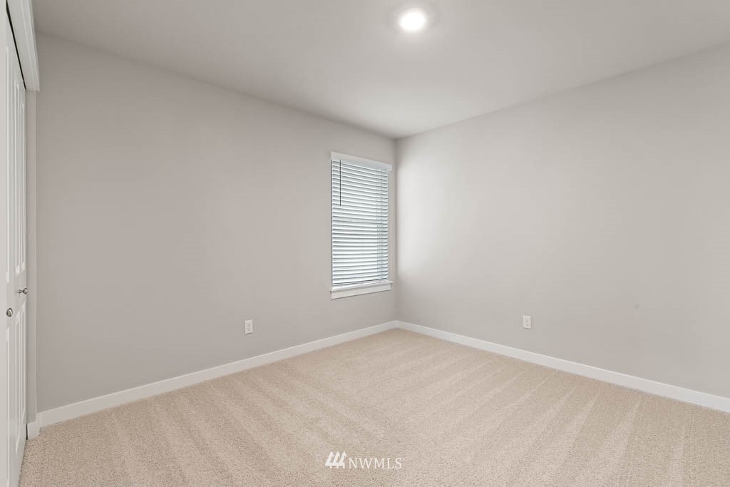 6 180th Place Southeast, Unit 34 Bothell, WA 98012 - Photo 24 of 36 a view of an empty room with a window