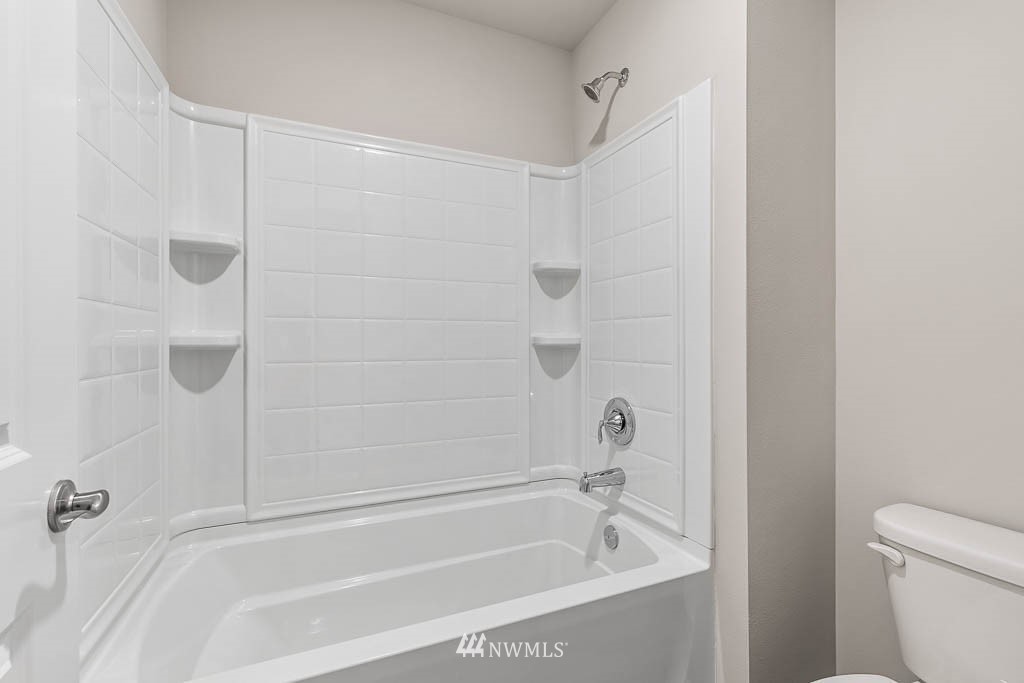 6 180th Place Southeast, Unit 34 Bothell, WA 98012 - Photo 28 of 36 a close view of a bathtub in bathroom