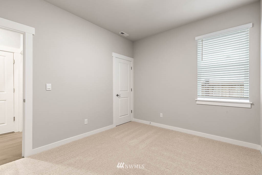 6 180th Place Southeast, Unit 34 Bothell, WA 98012 - Photo 8 of 36 an empty room with windows
