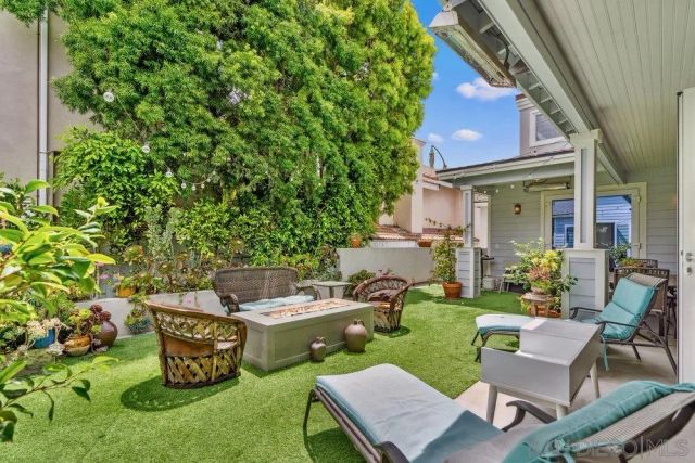 a patio with table and chairs